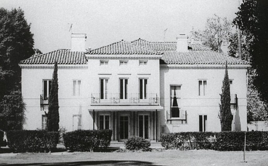 Historical black-and-white photo of Thomas R. Bard Mansion with trees, taken from the front.